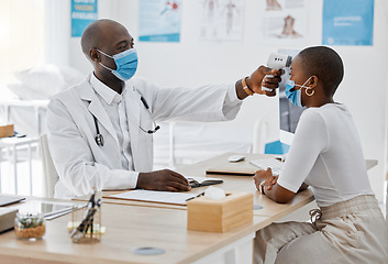 Image showing Doctor checking temperature of covid patient while testing for high fever symptoms of sick, flu or illness. Screening woman for a healthcare consult, checkup and visit in a hospital or medical clinic