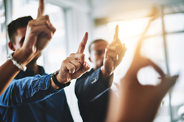 Image showing Business people holding up fingers asking a question in an office teamwork meeting. Marketing team waiting and raising hands for collaboration. Smart workers working together in a office