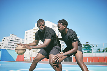 Image showing Basketball, fitness and active sports game played by young African men in an outdoor court for exercise. Training, workout and healthy guy friends playing a fun, friendly and athletic sport in summer