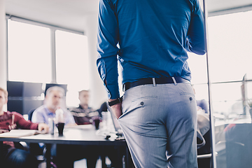 Image showing Business man making a presentation on corporate meeting.