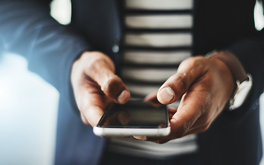 Image showing Hands of business man typing on phone, networking on social media and browsing internet at work. Closeup of a professional corporate employee checking a text, scrolling an app and reading message