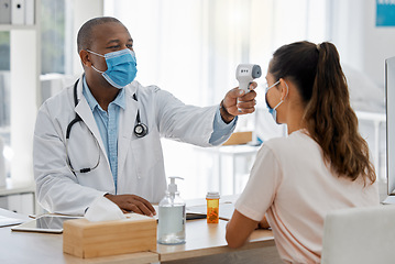 Image showing Temperature, covid thermometer and forehead fever check by doctor, medical professional and consulting healthcare worker. Sick or ill female patient with mask in clinic, hospital and health center