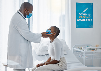 Image showing Doctor with patient in covid face mask doing examination of thyroid or throat disease during medical checkup, visit or appointment. Insurance healthcare worker checking woman for swelling or covid 19