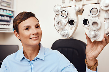 Image showing Portrait of professional optometrist, confident and happy in an optometry office preparing equipment for eye checks. Caucasian female health and ophthalmology expert ready to test a patient