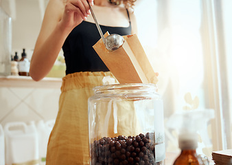 Image showing Plastic free, eco friendly and zero waste grocery store with consumer, shopper and customer buying ingredients and self service products. Woman purchasing fresh chocolate sweets in a supermarket shop