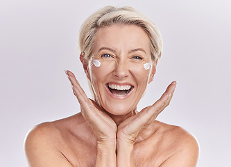 Image showing Skincare, happy and senior woman with smile in health, beauty and face in a studio background. Portrait of a mature female model in healthy wellness for skin care, cream or sunscreen.