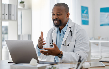 Image showing Telemedicine, healthcare and video call with doctor talking on laptop to online patient during a consultation. Happy black professional offering support or medical advice during a medical appointment