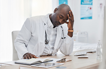 Image showing Stress, anxiety and sad doctor, medical professional and healthcare worker with negative test results on technology. Thinking gp with burnout headache or bad news in clinic, hospital or health center