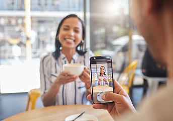 Image showing Love, coffee and a cafe, a happy couple meeting for a breakfast date in the city. A man taking a photo of woman on his phone, she has a smile on her face and a cup in her hands, friends and memories.