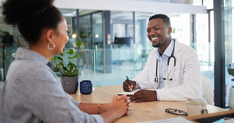 Image showing Doctors appointment of a woman patient consulting a doctor in a hospital office. Happy working medical and healthcare worker work with a smile talking about insurance, wellness and health success