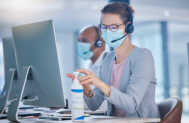 Image showing Sanitize, hygiene and compliance with covid19 regulations at call center with crm agent cleaning workstation. Woman working in customer service, making sure to leave desk fresh for the next operator