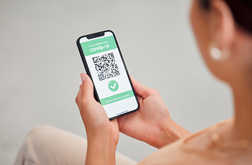 Image showing Covid vaccine passport, digital certificate and immunity travel pass displayed with qr code on phone screen for health clearance. Woman, tourist and traveler with mobile app for medical vaccination