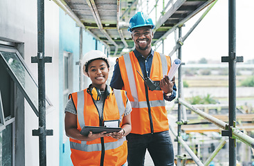 Image showing Builder and engineer working together as a construction team on a building site and standing on scaffolding. Portrait of a man and woman in a hardhat and vest at work on a new development project
