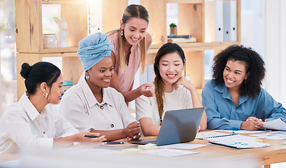 Image showing Laptop marketing strategy, branding and promotion project by diverse group of creative agents with vision, plan or idea. United, supportive or inclusive business women analyzing tech performance data