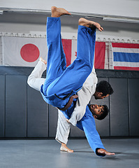 Image showing Health, fitness and motivation, men in karate fight for a winner in a dojo. Martial arts, a learning exercise to overcome, fight failure and beat the competition. Sports students in a battle to win.
