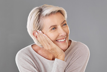 Image showing Thinking, idea and memory with a senior woman resting her head or chin on her hand in studio on a grey background. Skincare, health and beauty with a female looking to wellness and lifestyle