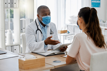 Image showing Doctors office, masks and sick patient consulting healthcare medic for covid virus test results at a hospital desk. Life insurance, people and medical employee giving woman support, help and service