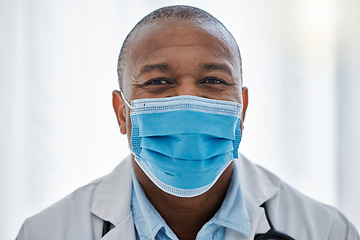 Image showing Covid doctor wearing face mask for safety, protection and hygiene while working in a medical hospital or clinic. Portrait of trusted male physician, healthcare expert and frontline worker in pandemic