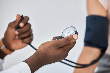 Image showing Blood pressure or hypertension test by a healthcare professional on a female at the clinic or hospital. Closeup of a medical worker or GP checking a hypertensive woman or patient using a tensiometer