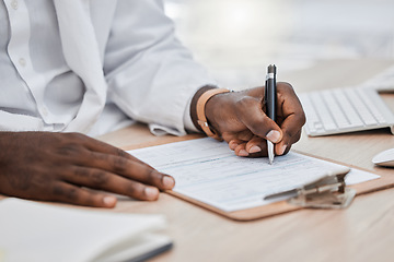 Image showing Doctor writing a prescription or medical history, record or insurance in his office and working on a health document. Closeup of a healthcare black male professional or GP signing a contract