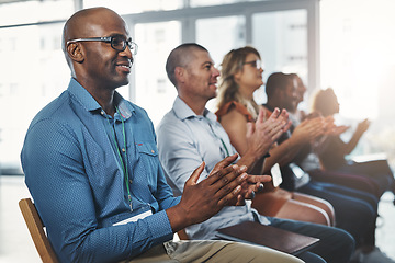 Image showing Employees sitting and clapping together in a seminar and successful workshop. Diverse workplace that support the staff with a training conference. Celebrating professional relationships in business.