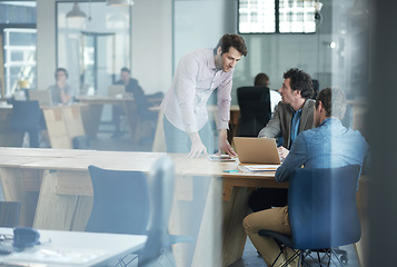 Image showing Thinking, talking and teamwork of serious business workers working together in a coworking office. Marketing team work on online content for a project. Colleagues planning a group collaboration