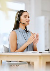 Image showing Call center agent, sales advisor and telemarketing employee listening to a client giving them their payment data. Call centre professional giving customer support services about us at her help desk