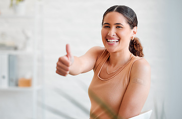 Image showing Thumbs up, vaccinated and health with plaster after covid vaccine for business protocol or policy and protection against virus. Face of a female worker showing positive hand gesture after injection