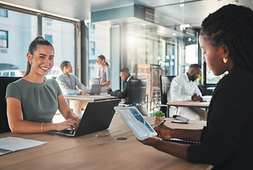 Image showing Portrait of a young digital marketing agency employee writing a proposal or a growth strategy for the company. Happy, excited and smiling business woman working in a busy office typing on a laptop