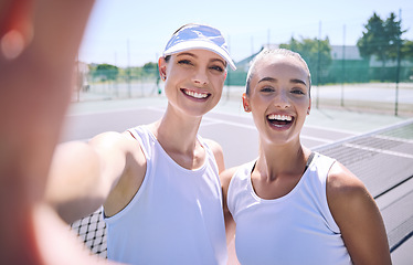 Image showing Selfie taking team of female tennis players on the court after a game, match or tournament portrait. Fit sporty teammates, athletes or professionals relax after being active, exercise and training