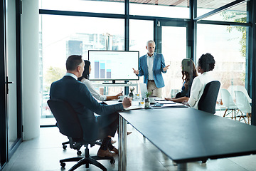 Image showing Manager, leader and boss talking to his team or group of colleagues in a presentation, seminar or workshop in a boardroom meeting. Discussing strategy, the company mission and vision for the future