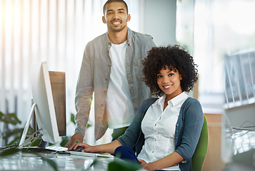 Image showing Happy manager or leader helping an employee on a computer to plan ideas or business growth strategy. African female intern or trainee working for a startup and training in the IT department