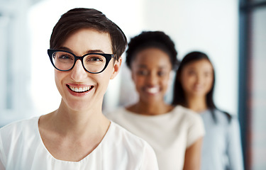 Image showing Smiling and successful female business woman feeling happy about office success and teamwork. Portrait of a modern woman worker about to work. Ambitious employee excited about career opportunity