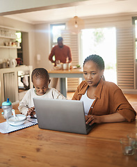 Image showing Busy, serious and multitask mother working on laptop while taking care of her child at home. Black entrepreneur or freelancer analyzing online reports with her and cute son playing games on a phone