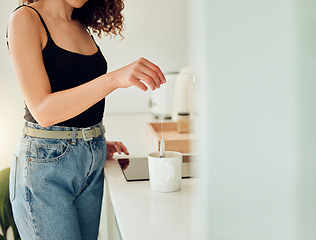 Image showing Woman hand holding herbal tea bag over cup of boiling water, making chai in kitchen taking a break. Female barista woman working at cafe or coffee shop counter, hot drink during office lunch break.