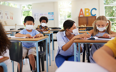 Image showing Covid learning with teacher and school students having lesson, study and education in class during pandemic. Educator helping, showing and talking to young kindergarten, preschool and elementary kids