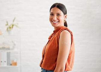 Image showing Smiling, happy and motivated female entrepreneur showing great leadership in a creative office with copy space. Portrait of confident and proud entrepreneur satisfied with job in a startup business