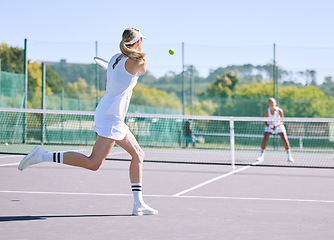 Image showing Fitness, balance and sport with woman tennis players practice competitive match at a sport court. Professional athlete workout at a game or competition. Lady training sports together with partner