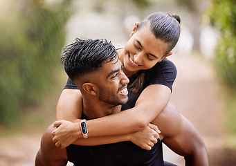 Image showing Wet, fitness couple playing in the rain during fun romantic outdoor training, running or healthy workout exercise in park. Happy sport people with a smile or caring man giving woman a piggyback ride