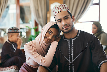 Image showing Married muslim couple together with family celebrating islamic religious holiday event wishing an eid mubarak or ramadan kareem. Traditional, and cultural in love husband and wife sitting at home