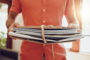 Image showing Holding recycle and paper stack closeup of hands inside environmentally friendly home. Sustainable, waste management and eco friendly person who cares about the earth and rubbish reuse.