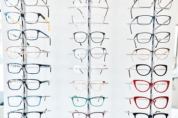 Image showing Glasses, optometrist and shelf with new, trendy and colorful spectacles in a display window in the retail and eye care industry. Window shopping eyewear on showcase in an optometry or optical store