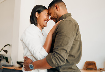 Image showing Romantic, laughing and hugging couple bonding, spending time together or feeling in love at home. Happy, smiling and embracing man and woman sharing intimate moment with touching foreheads in lounge