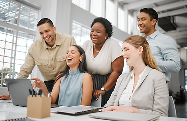 Image showing Cheerful, joyful professional business people looking at laptop, browsing funny videos online and bonding on break in office at work. Corporate, diverse and young colleagues searching the internet