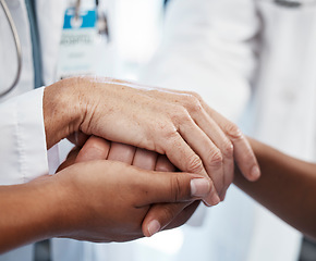 Image showing Doctor, holding a patients hands and comforting them after the loss of a loved one at a hospital. Medical consultant, reassuring sick person after a cancer diagnosis and giving support or treatment.