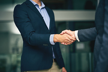 Image showing Closeup of businesswomen shaking hands during a meeting in an office. Colleagues finalizing a successful promotion, deal and merger. Coworkers greet, collaborate and negotiate during job interview