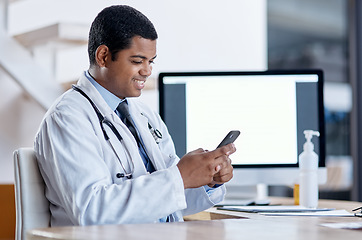 Image showing Doctor consulting with an online patient on video call on a phone, doing telemedicine and listening during a medical appointment. Happy, smiling professional worker reading email and checking planner