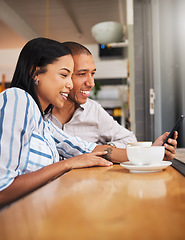 Image showing Happy couple reading social media on phone, bonding on a coffee break at a care. Smiling boyfriend and girlfriend browsing online, checking for discount and booking, enjoying free time off on weekend
