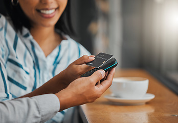 Image showing Hands paying bill with credit card payment for coffee or tea at cafe, coffee shop or restaurant close up. Woman making cashless purchase with help and assistance from store worker, employee or waiter