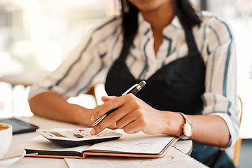 Image showing Hands of business owner taking orders, calculating profit and working on budget for startup while sitting at a table at work. Closeup of a female employee doing finance job, sorting bill and writing